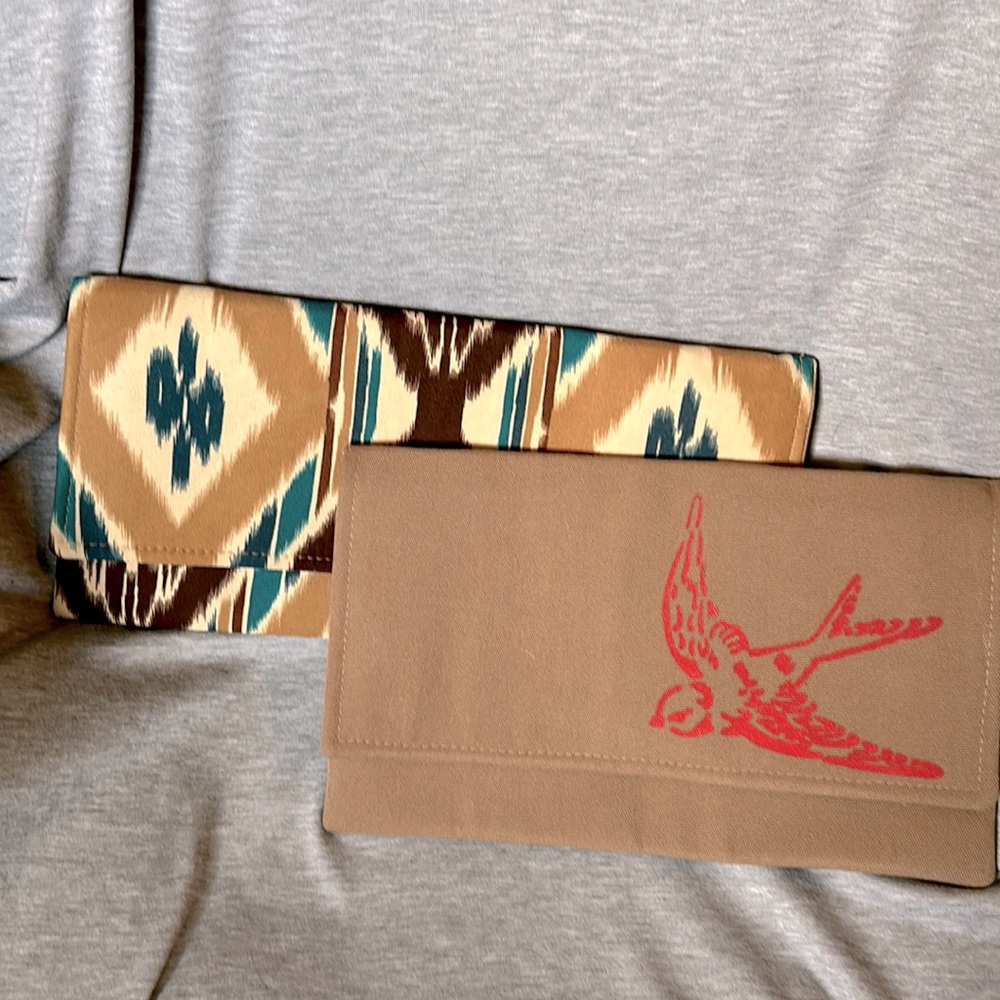 Two new, never used, fabric clutches by Mojo Spa, a Chicago-based salon.